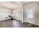 Inviting living room with natural light, white wainscoting, and hardwood flooring at 50 Crabapple Ridge Dr, Oxford, GA 30054