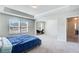 Spacious main bedroom with carpet, tray ceiling, and sitting area is a cozy retreat at 50 Crabapple Ridge Dr, Oxford, GA 30054
