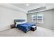 Spacious main bedroom with tray ceiling, carpet, and windows at 50 Crabapple Ridge Dr, Oxford, GA 30054