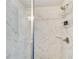 Close-up of the tiled walk-in shower with a modern shower head and corner caddy at 50 Crabapple Ridge Dr, Oxford, GA 30054