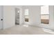 This bedroom features carpet floors, natural lighting, and an en-suite bathroom at 528 Pearl St, Cumming, GA 30519