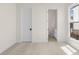 This bedroom features carpet floors, natural lighting, and an en-suite bathroom at 528 Pearl St, Cumming, GA 30519