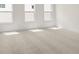 Bedroom featuring a neutral color palette, soft carpet, and natural lighting at 528 Pearl St, Cumming, GA 30519