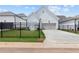 Home's concrete driveway and fence, surrounded by a well-maintained lawn and landscaping at 528 Pearl St, Cumming, GA 30519