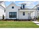 Charming, craftsman style home with white wood facade, black trim, and an inviting front porch at 528 Pearl St, Cumming, GA 30519