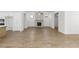Bright living room with a fireplace, ceiling fan, and open floor plan at 528 Pearl St, Cumming, GA 30519