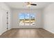 Bright living room with a large window and access to another room at 528 Pearl St, Cumming, GA 30519