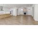 Spacious living room with a fireplace, ceiling fan, and open floor plan at 528 Pearl St, Cumming, GA 30519