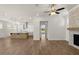 Spacious living room featuring an open floor plan, fireplace, and eat-in kitchen at 528 Pearl St, Cumming, GA 30519