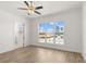 Living room with a large window and access to a bathroom at 528 Pearl St, Cumming, GA 30519