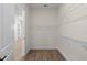 This walk-in closet features white walls and wire shelving at 528 Pearl St, Cumming, GA 30519
