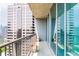 Condo balcony featuring metal railings and sliding glass doors offering city views and sunlight at 1080 Peachtree St # 2116, Atlanta, GA 30309