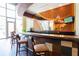 Modern bar area with unique wood accents, stylish seating, and access to the outdoors at 1080 Peachtree St # 2116, Atlanta, GA 30309