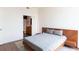Bedroom featuring a comfortable bed, modern design elements, and a glimpse of the ensuite bath at 1080 Peachtree St # 2116, Atlanta, GA 30309