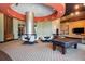 Spacious game room featuring a pool table, seating areas, and entertainment options at 1080 Peachtree St # 2116, Atlanta, GA 30309
