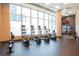 Bright gym with modern cardio equipment, including treadmills, ellipticals, and rowing machines at 1080 Peachtree St # 2116, Atlanta, GA 30309