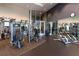Well-lit gym features weight machines, mirrors, and access to the outdoors at 1080 Peachtree St # 2116, Atlanta, GA 30309