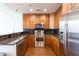 Modern kitchen with stainless steel appliances, granite countertops, and dark backsplash at 1080 Peachtree St # 2116, Atlanta, GA 30309