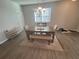 Cozy dining room featuring a modern chandelier, wood table, and comfortable seating at 1852 Laurel Green Way, East Point, GA 30344