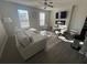 Bright living room with hardwood floors, a modern ceiling fan, and abundant natural light at 1852 Laurel Green Way, East Point, GA 30344