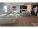 Bright open-concept living space with modern kitchen, hardwood floors and stylish furniture at 1852 Laurel Green Way, East Point, GA 30344