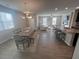 Open-concept living space with a dining room, kitchen, and spacious living room, perfect for entertaining at 1852 Laurel Green Way, East Point, GA 30344