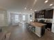 Open-concept living space with modern kitchen, spacious living room, and stylish breakfast bar at 1852 Laurel Green Way, East Point, GA 30344
