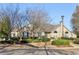 Well-maintained building with lush landscaping and a sign at the entrance at 302 Gladstone Dr, Mcdonough, GA 30253