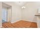 Dining room with hardwood floors and neutral paint, connected to other rooms at 302 Gladstone Dr, Mcdonough, GA 30253