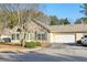 Charming single-story home with stone accents, a two-car garage, and a well-maintained lawn at 302 Gladstone Dr, Mcdonough, GA 30253