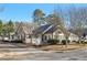 Inviting single-story home boasting a stone facade, arched windows, and verdant landscaping at 302 Gladstone Dr, Mcdonough, GA 30253