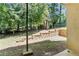 Image showcases the green backyard with layered retaining wall at 2396 Lawrenceville Hwy # V, Decatur, GA 30033