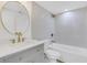A bathroom features a stylish vanity, gold fixtures, and a shower-tub combo at 2396 Lawrenceville Hwy # V, Decatur, GA 30033