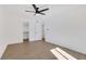 A bright bedroom features hardwood floors, ceiling fan and closet at 2396 Lawrenceville Hwy # V, Decatur, GA 30033