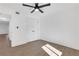 Bedroom features wood-look floors, contemporary ceiling fan, and closet with white doors at 2396 Lawrenceville Hwy # V, Decatur, GA 30033