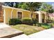 Exterior view of a condo community building, with landscaped grounds at 2396 Lawrenceville Hwy # V, Decatur, GA 30033