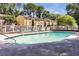Condo community outdoor pool with lounge chairs and well-maintained grounds at 2396 Lawrenceville Hwy # V, Decatur, GA 30033