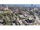Birds eye view of community buildings, roads, and ball field surrounded by dense trees at 6275 Hunting Creek Rd, Atlanta, GA 30328