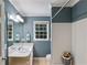 Cozy bathroom with a white sink, window and tiled shower at 6275 Hunting Creek Rd, Atlanta, GA 30328