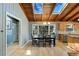 Bright dining room features hardwood floors, wood ceilings with skylights, and a view of the backyard at 6275 Hunting Creek Rd, Atlanta, GA 30328