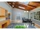 Kitchen and dining area featuring wood ceilings, stainless steel appliances, and an island at 6275 Hunting Creek Rd, Atlanta, GA 30328