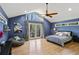 Bright main bedroom with a vaulted ceiling, french doors, and neutral walls at 6275 Hunting Creek Rd, Atlanta, GA 30328