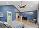 The bright main bedroom features a vaulted ceiling, wood floors, seating area, and an ensuite bathroom at 6275 Hunting Creek Rd, Atlanta, GA 30328
