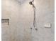 Tiled walk-in shower featuring an adjustable shower head and built in shower niche at 6275 Hunting Creek Rd, Atlanta, GA 30328