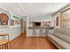 Finished basement with a stylish bar area, seating, and wood-look floors at 7565 Heard Rd, Cumming, GA 30041