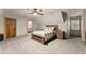 Spacious carpeted bedroom with a window, closet and a warm, inviting atmosphere at 7565 Heard Rd, Cumming, GA 30041