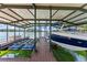 Covered boat dock with a boat lift, providing easy access to the lake at 7565 Heard Rd, Cumming, GA 30041