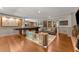 Spacious living room showcasing hardwood floors, a game table, and comfortable seating at 7565 Heard Rd, Cumming, GA 30041