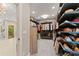 Large walk-in closet featuring custom shelving and hanging racks for optimal storage at 7565 Heard Rd, Cumming, GA 30041