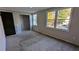 A bedroom with three windows with exterior views and closet with hanging rods at 917 Regency Path Dr, Decatur, GA 30030